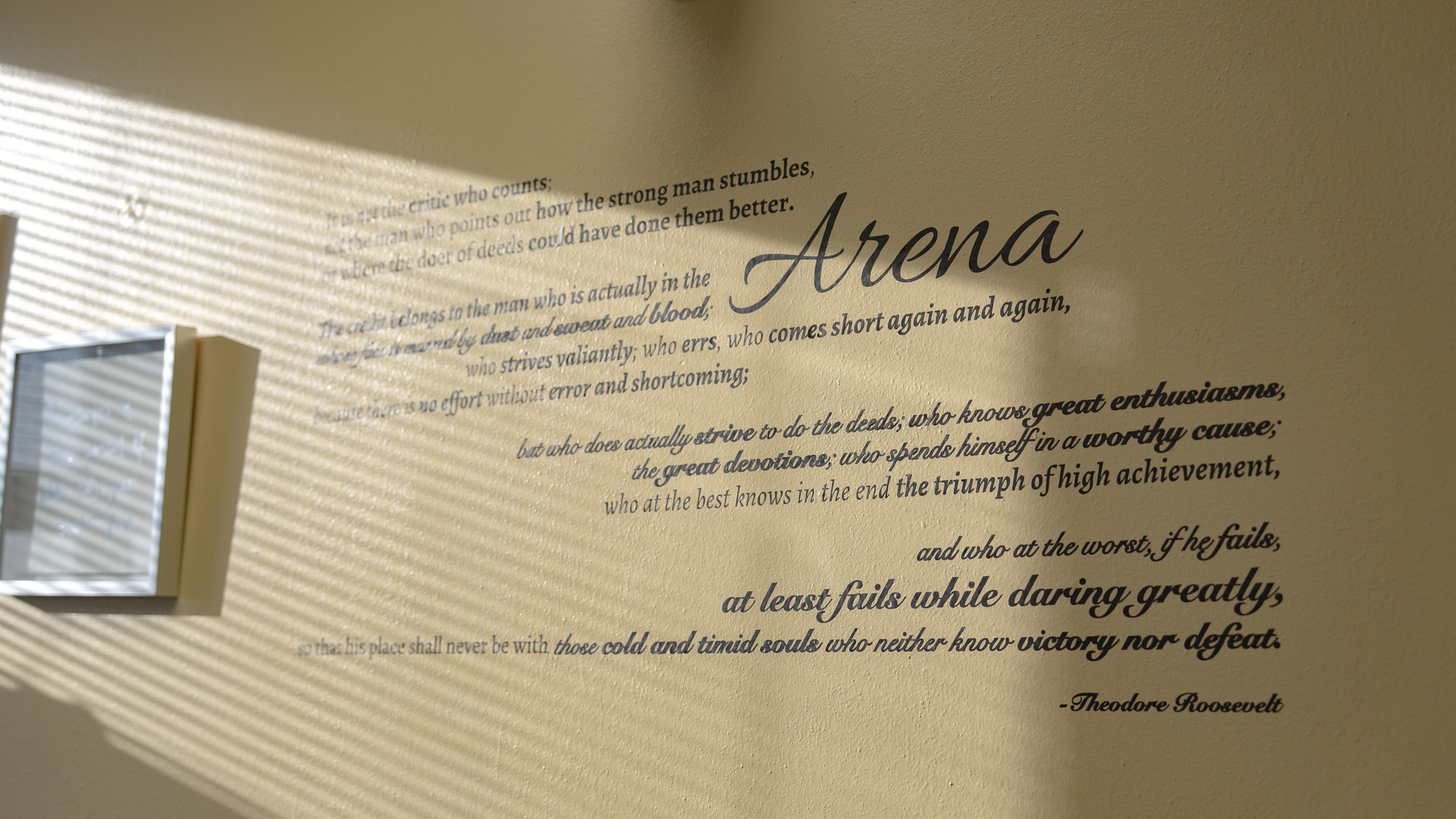 The Arena quote by Theodore Roosevelt on the wall at Core Edge Prep
