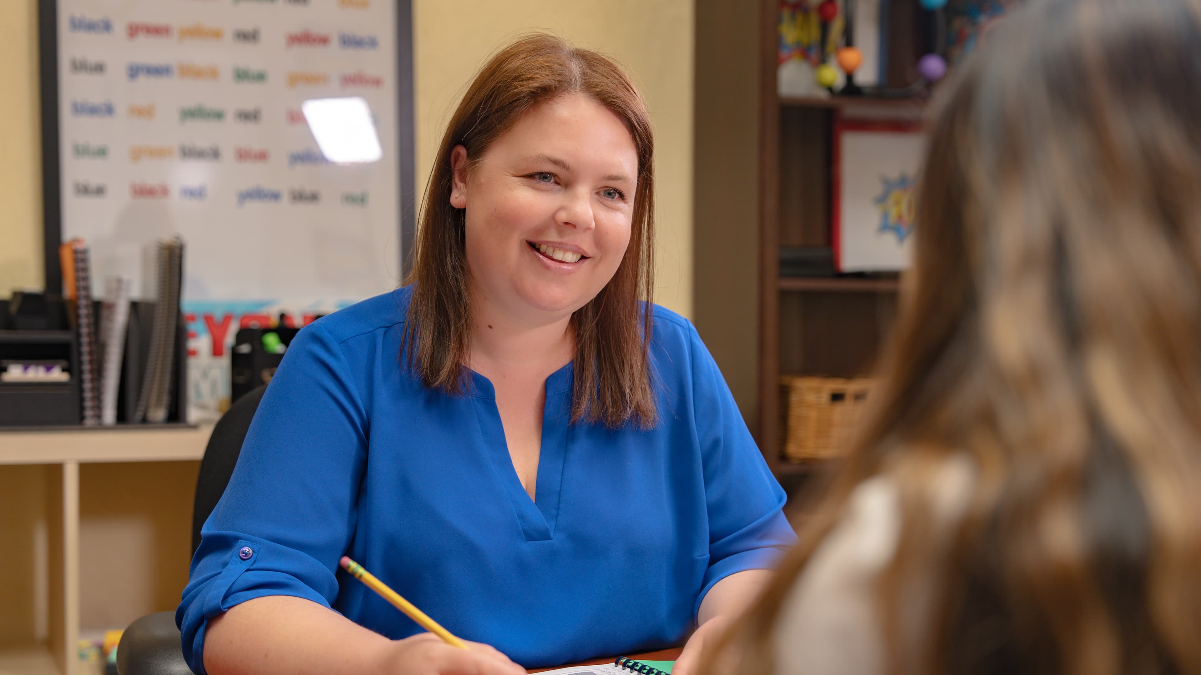Tutor working with student
